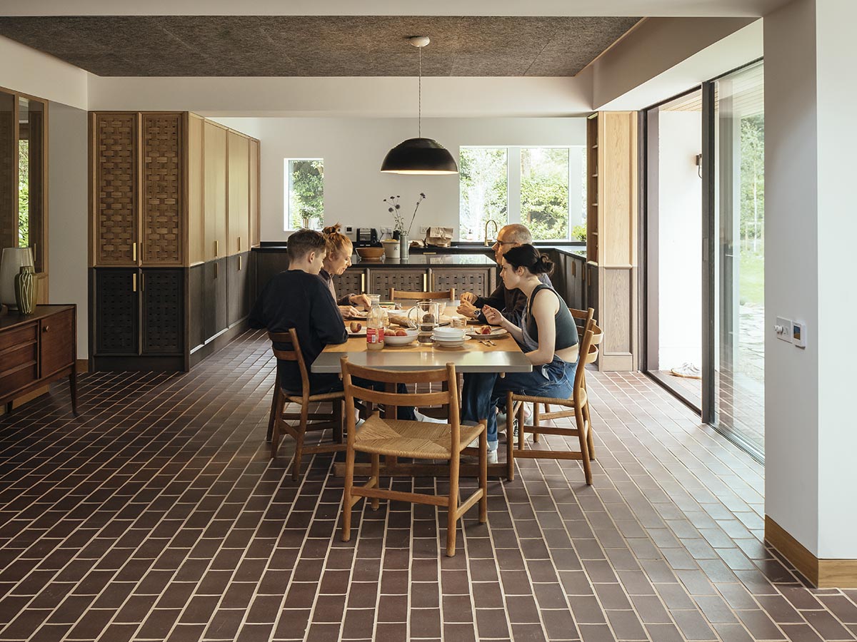 RIBA award winning house in Farnham by Rural Office  with brown brindle quarry tiles as part of a natural palette of materials