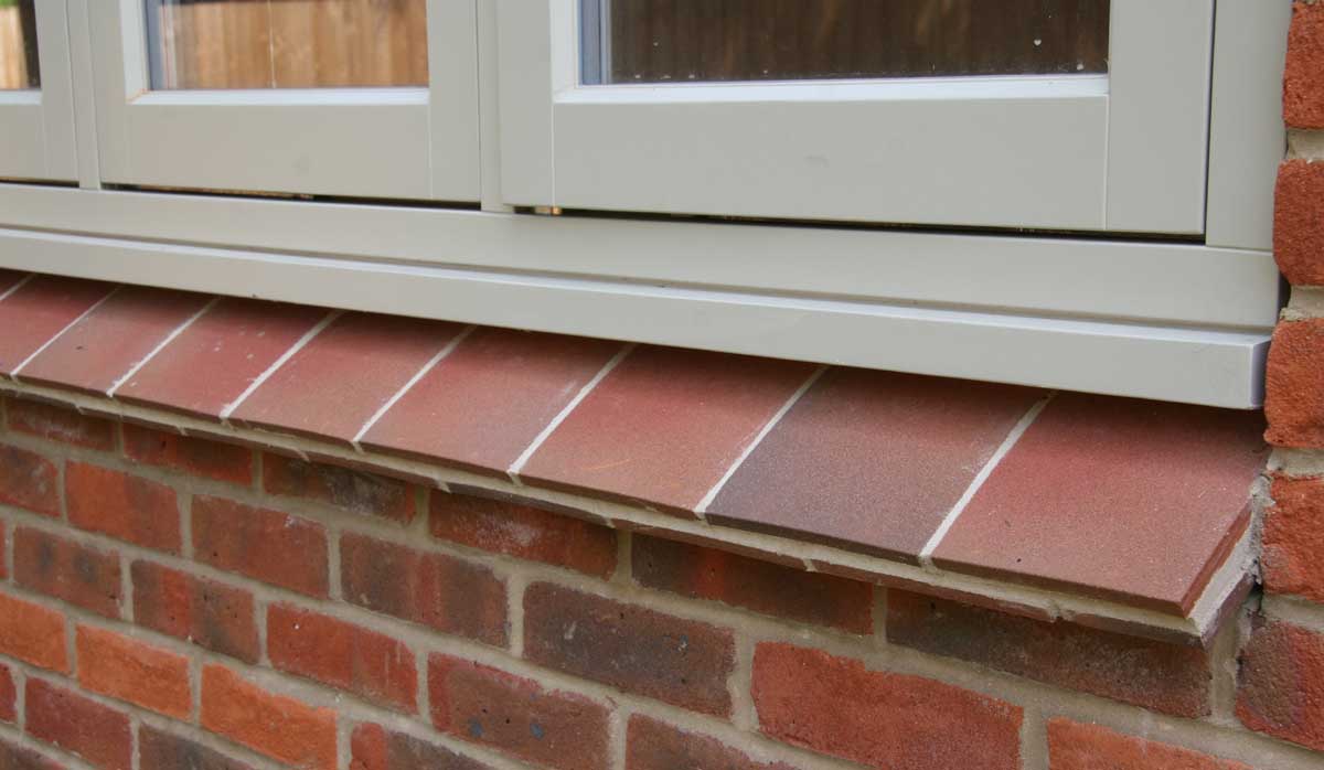country brown tiles used as creasing tiles under the window