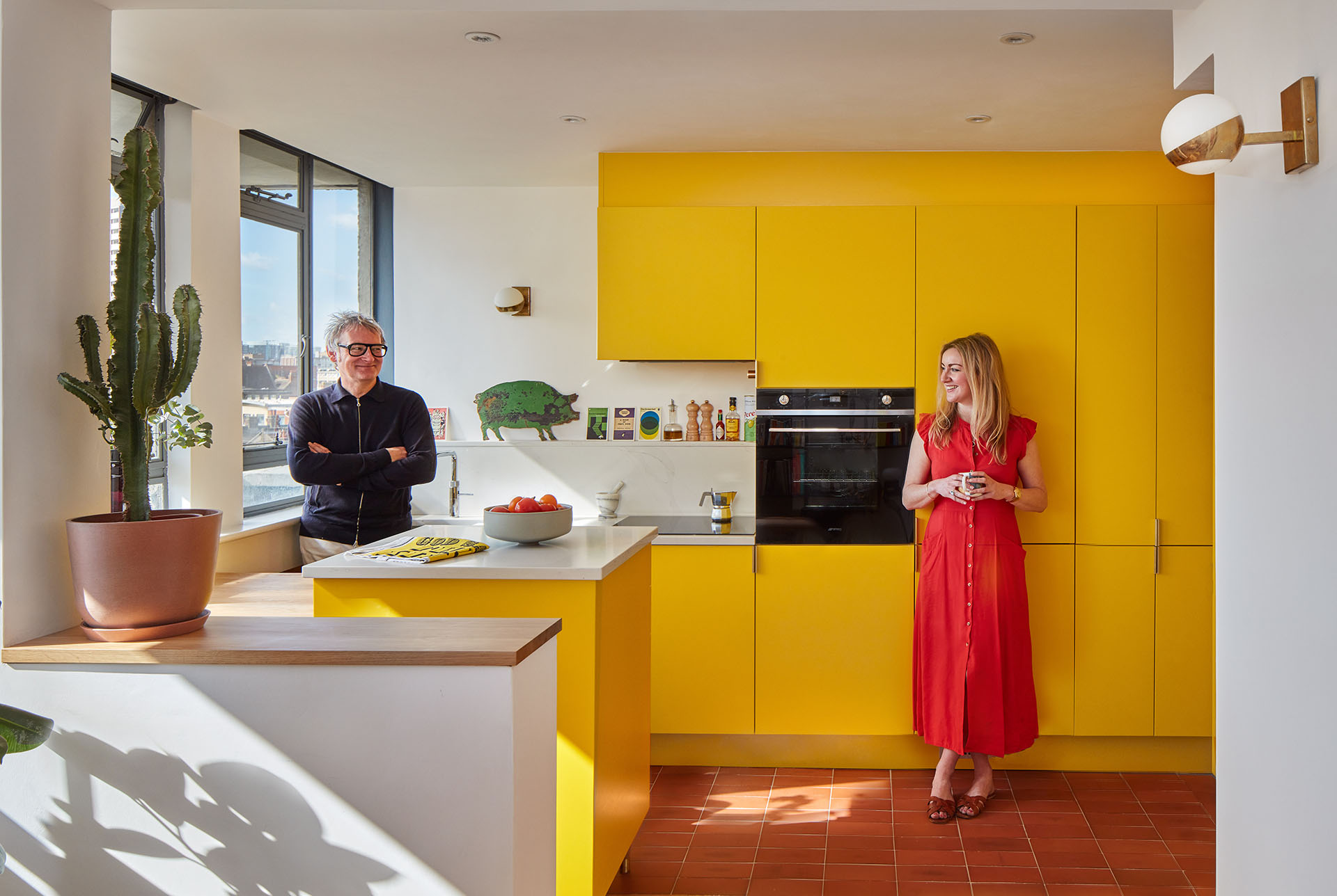 Architect Jenny Fleming in her apartment at Keeling House with Ketley red quarry tiles