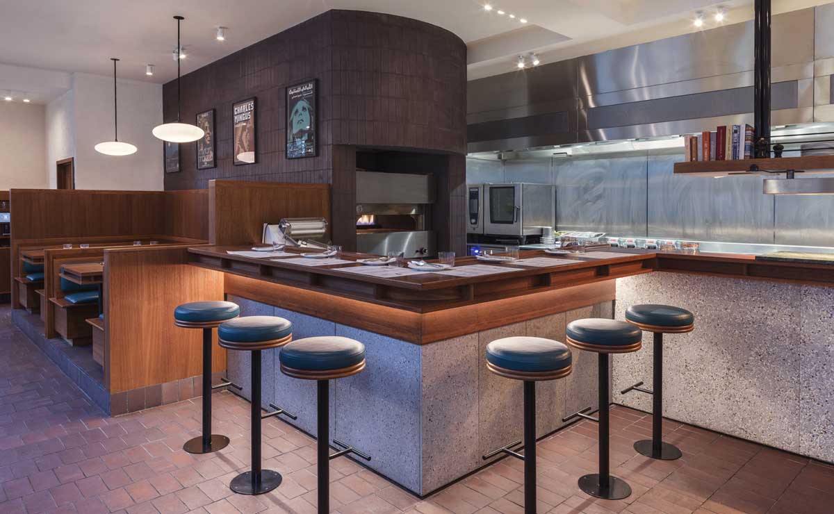 Brown brindle brick slips on the wall and quarry tiles on the floor at Arabica Restaurant in Kings Cross