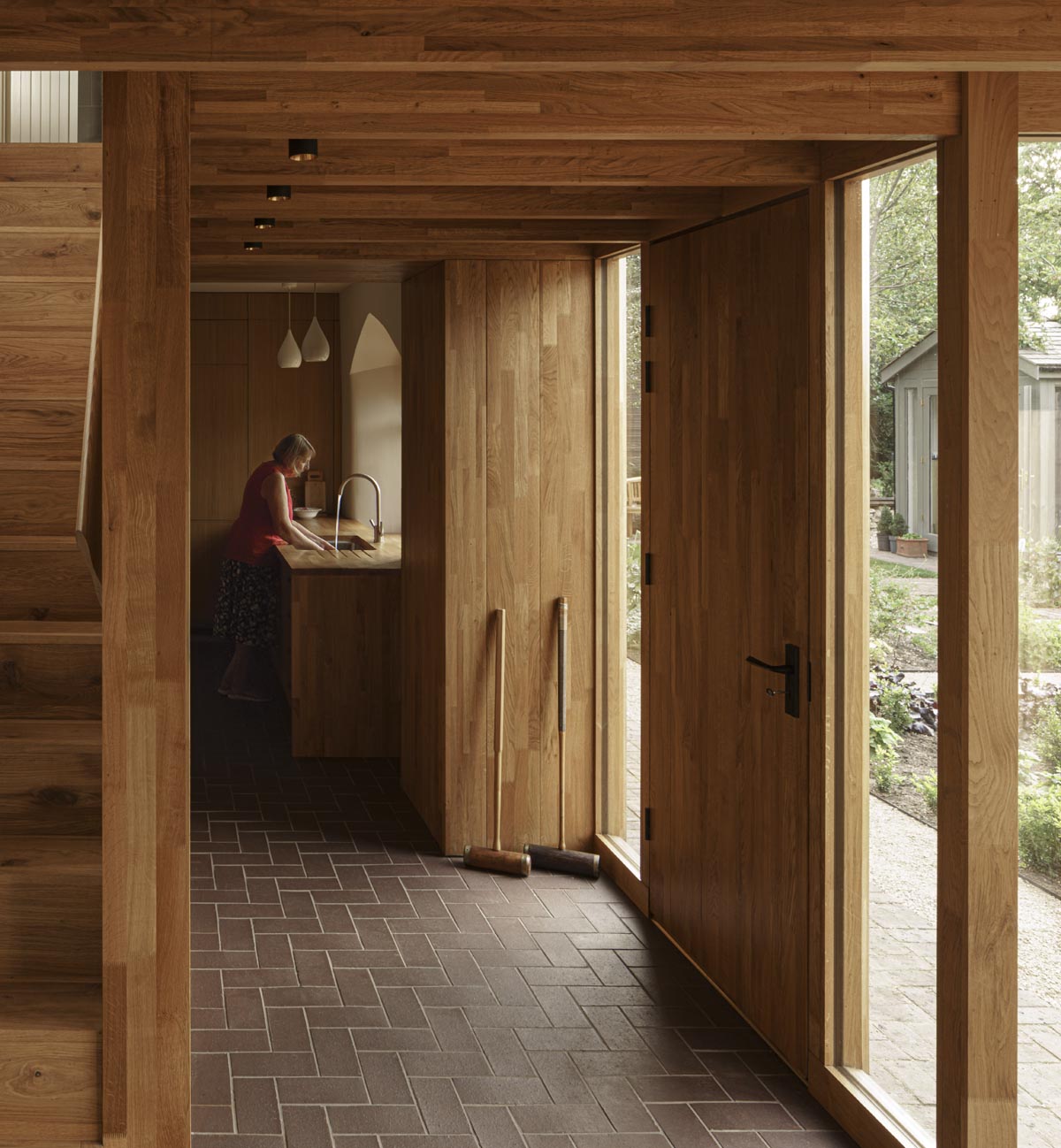 Brown brindle quarry tiles complement the oak structure in this refurbishment project