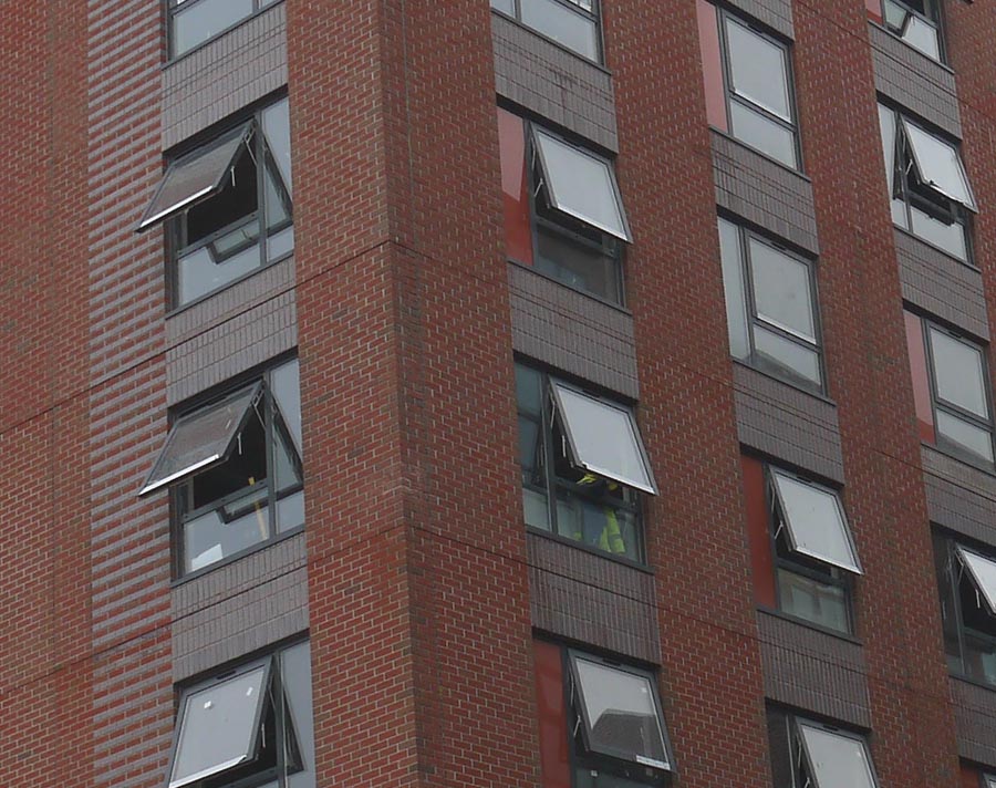 Brown brindle  brickslips provide detail around the wondows at Liverpools Baltic Triangle