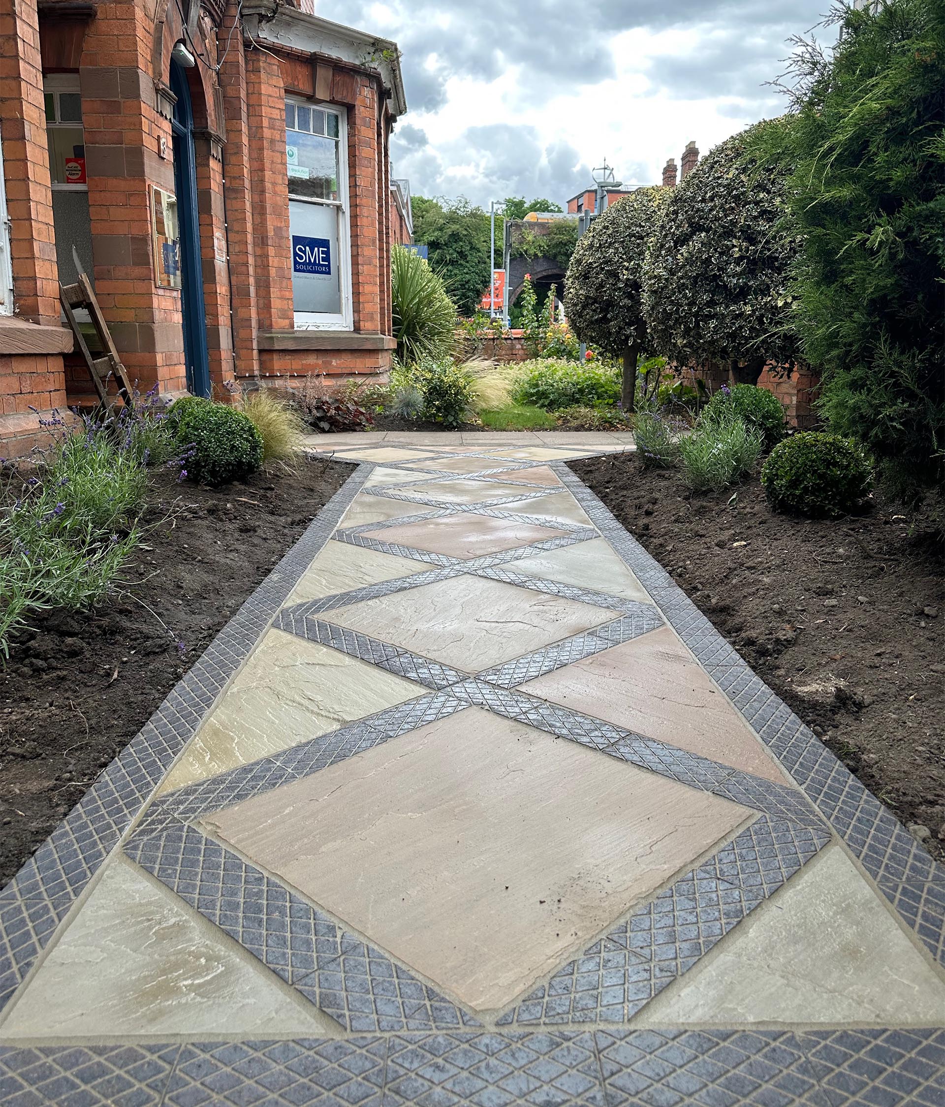 Instant Scenery used Ketley diamond chequer pavers to add detail to the path of this heritage building in Worcester