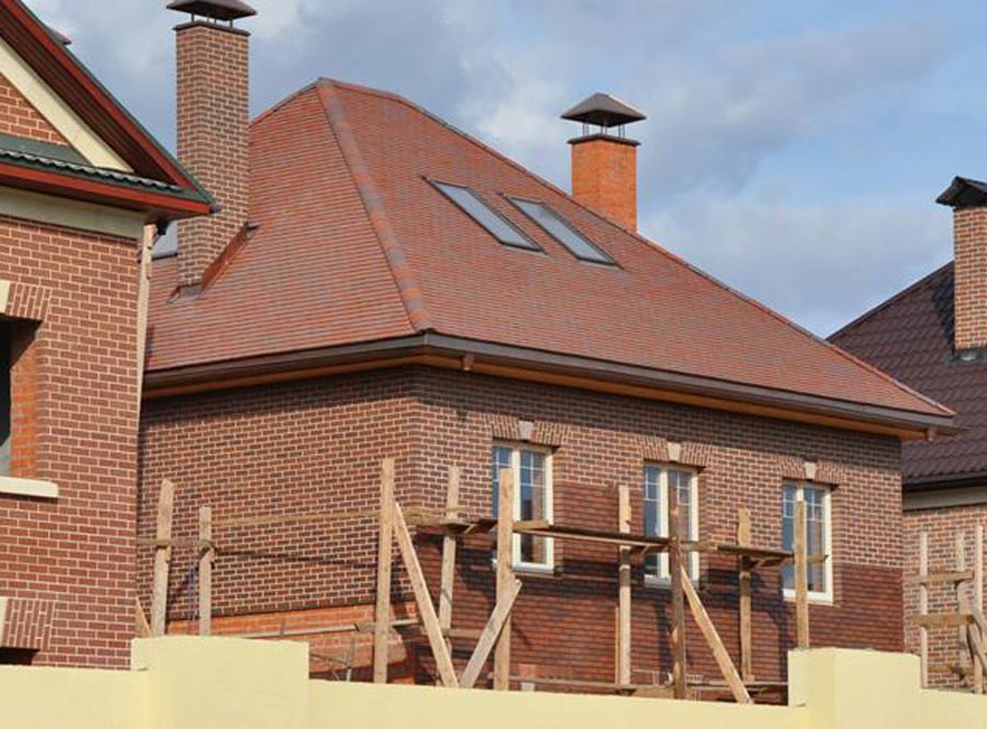 Light multi brick slips in the process of being mortared