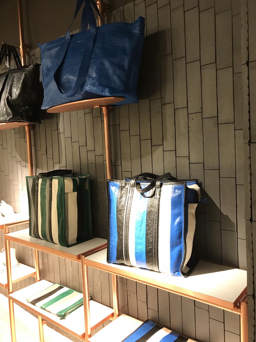 Staffs blue smooth brickslips on the wall at a handbag display in Harvey Nicholls