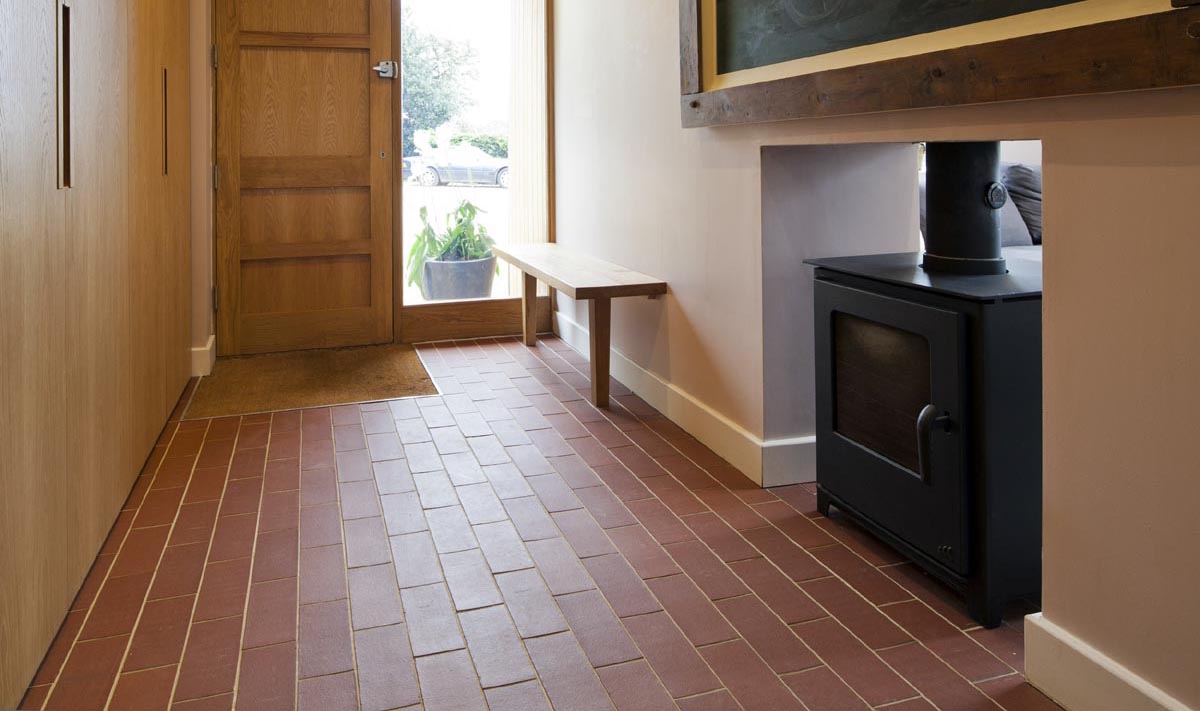 Staffs red quarry tiles laid over underfloor heating 1