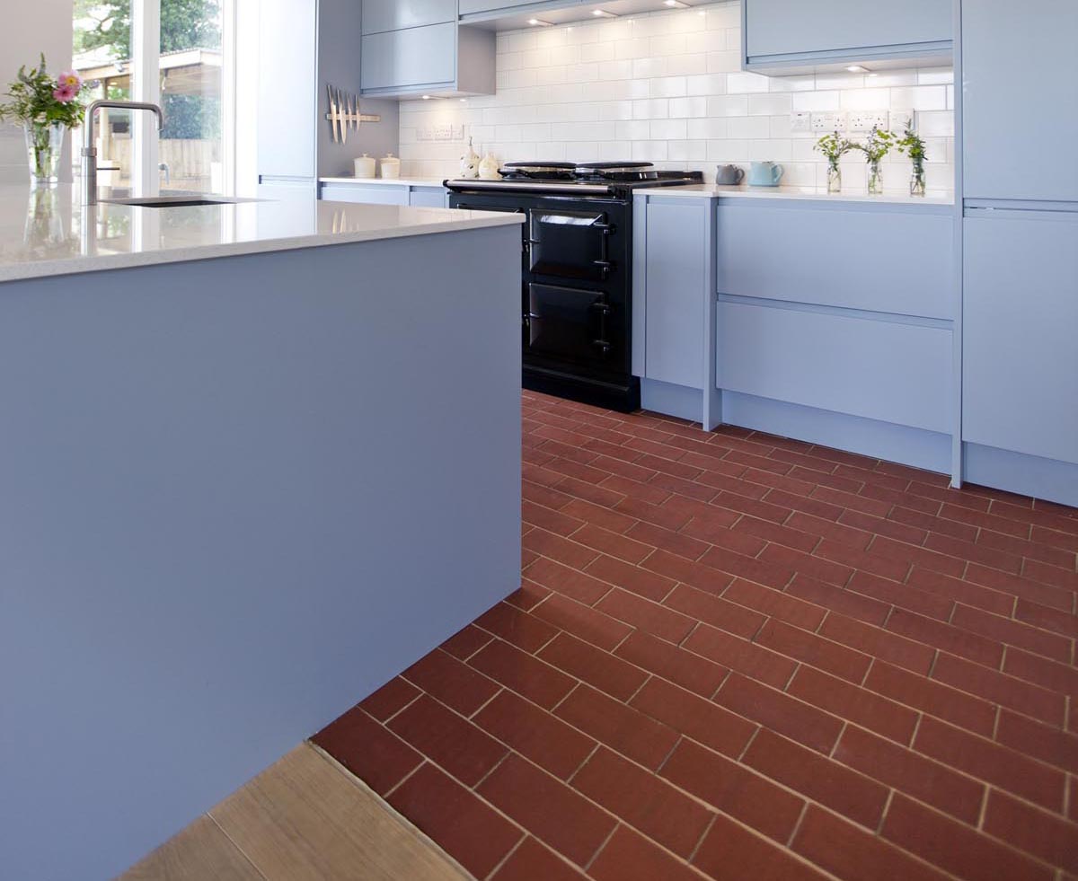 Staffs red rectangular quarry tiles laid over underfloor heating in a contemporary kitchen 1