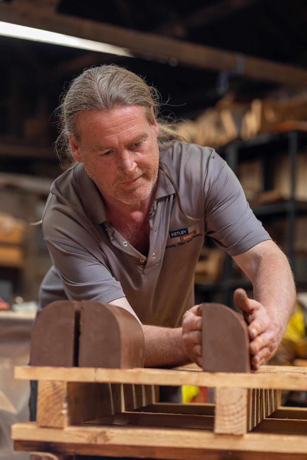 Steve Cartright stacking bullnose stretchers for drying Photography Photo Credit Rob Hill