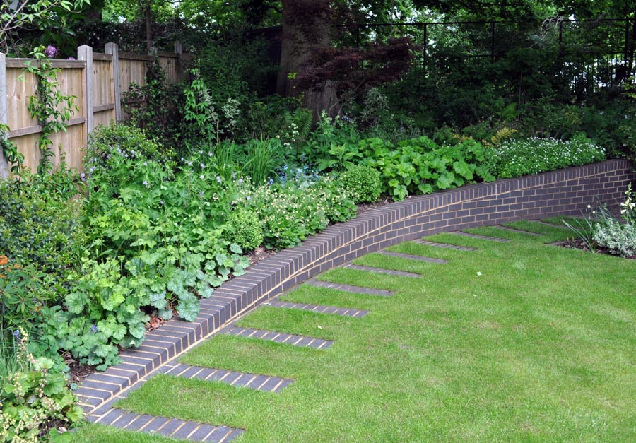curved retaining wall in a North London garden