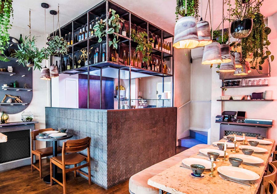 diamond chequer pavers on the wall to frame the open kitchen in Mamies a trendy creperie in Covent Garden
