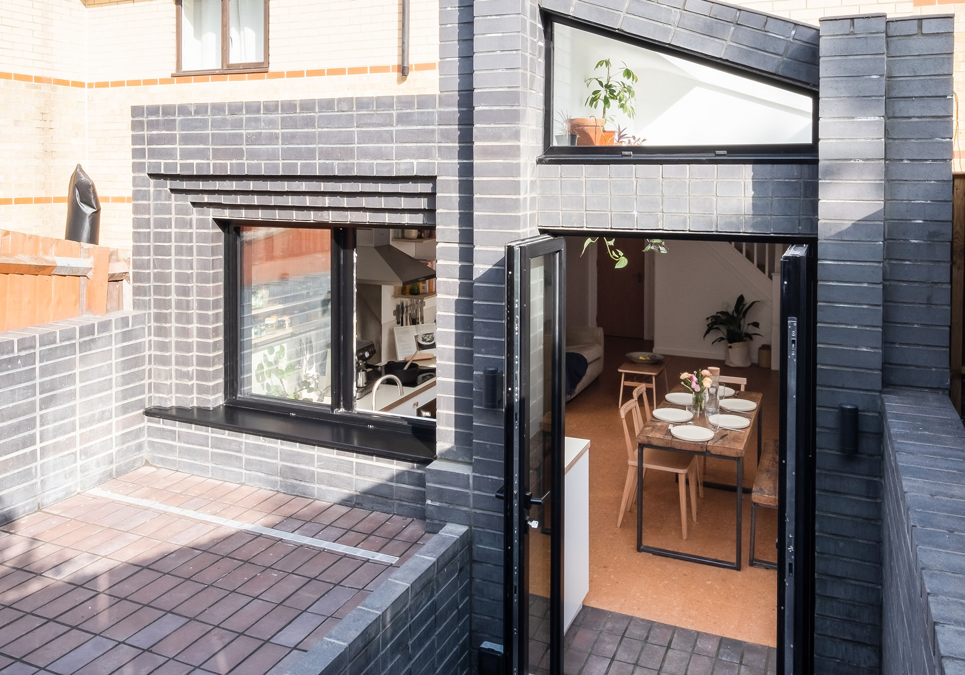residential extension by Studio Manifest using Ketley Staffs blue bricks and brown brindle quarry tiles image by David Valinsky