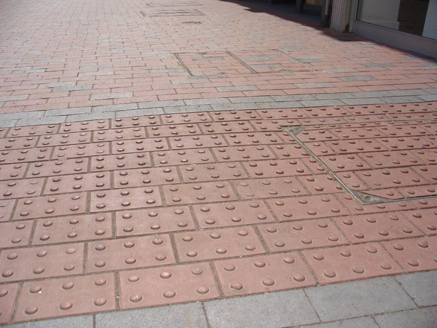 staffs red blister pavers alongside plain staffs blue pavers in Tonbridge